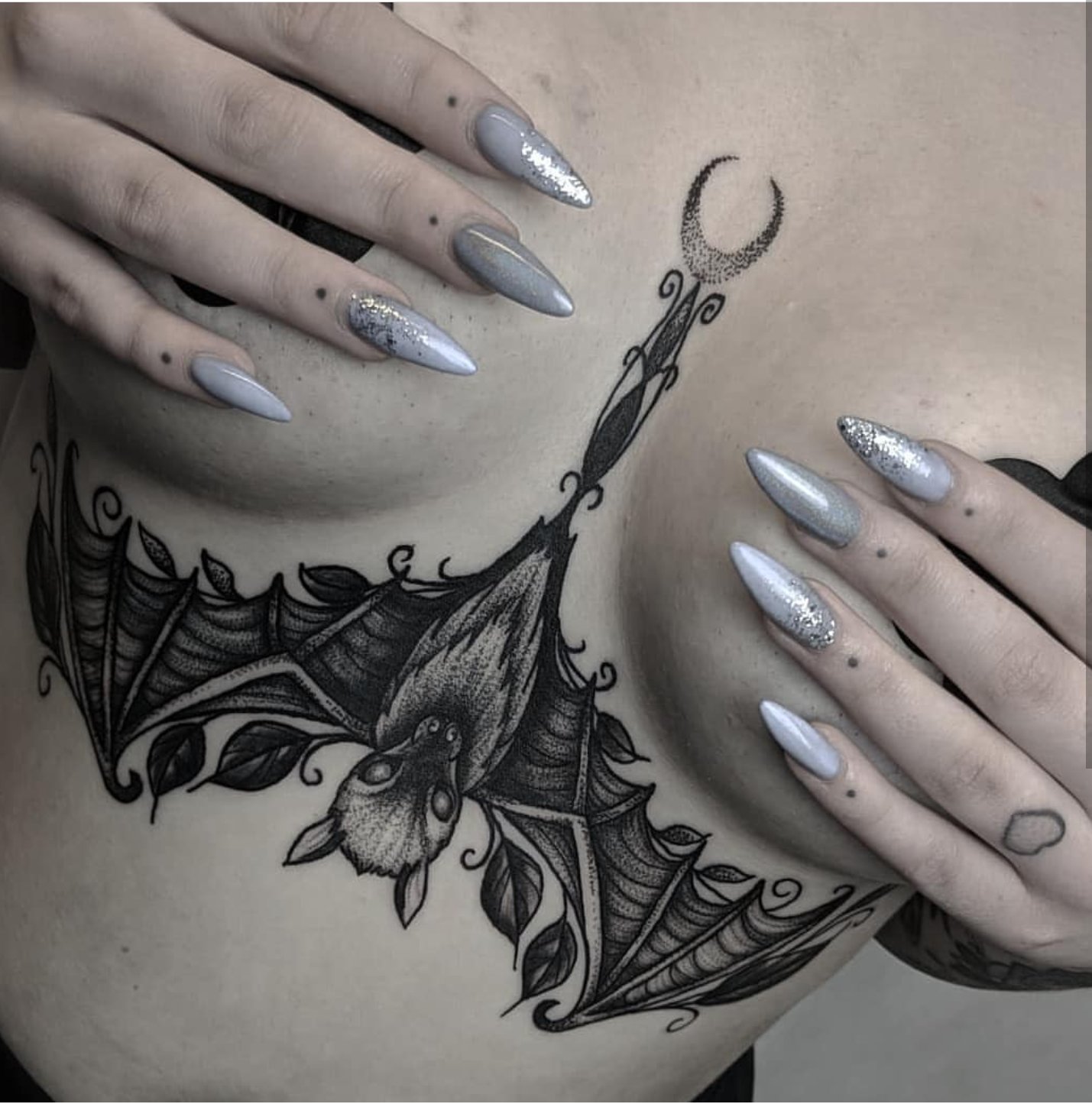 bat hanging upside down tattoo