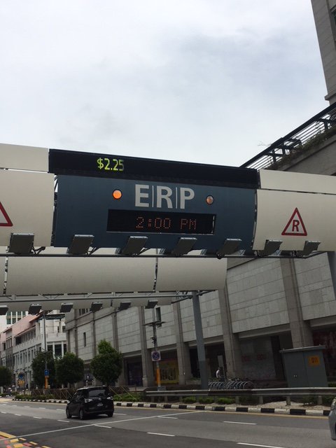 l_kenney's tweet photo. Even while on vacation I can't ignore interesting transportation things (all in Singapore): tolled roads in the urban core, electric car sharing, and special cards to extend pedestrian crossing times for those who need it. #coolhuh https://t.co/cS4Yj1T8Sg