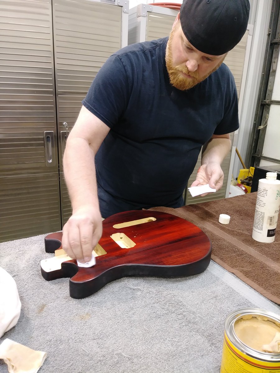 As James continued staining the body of his guitar, it took on a deep red orange color. Assembly is next. #guitar #Nashville #thingstodo