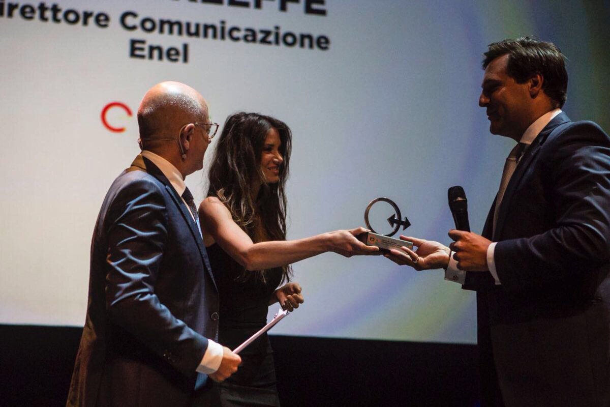 EnelGroup's tweet photo. From Open Power to What's Your Power. Our Director of Communications @rokeeffe100 receives the "Communications Ambassador 2018" award at the #NCAwards, recognising an “engaging and innovative dialogue” driven by Enel over the last 3 years. https://t.co/lrQz3NRihQ