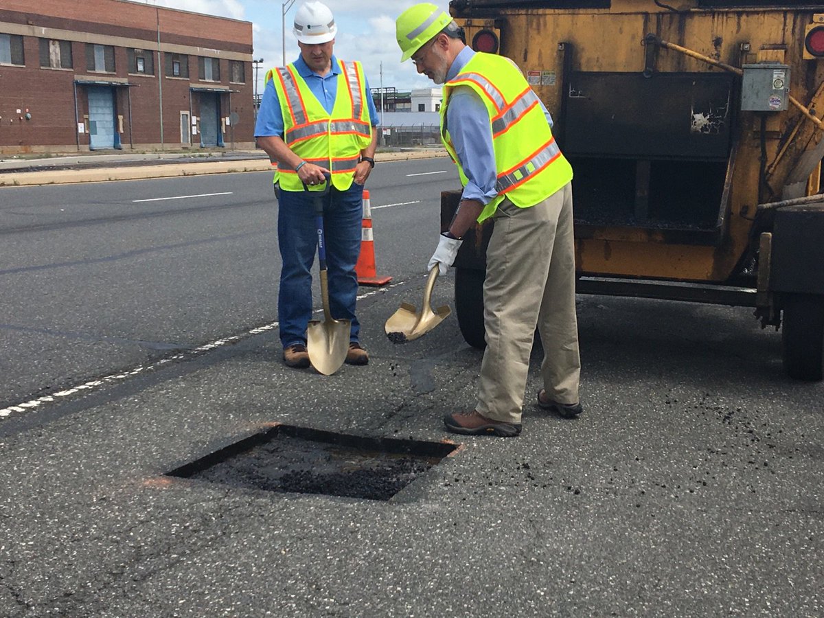 Photo of Governor Wolf fixing pothole