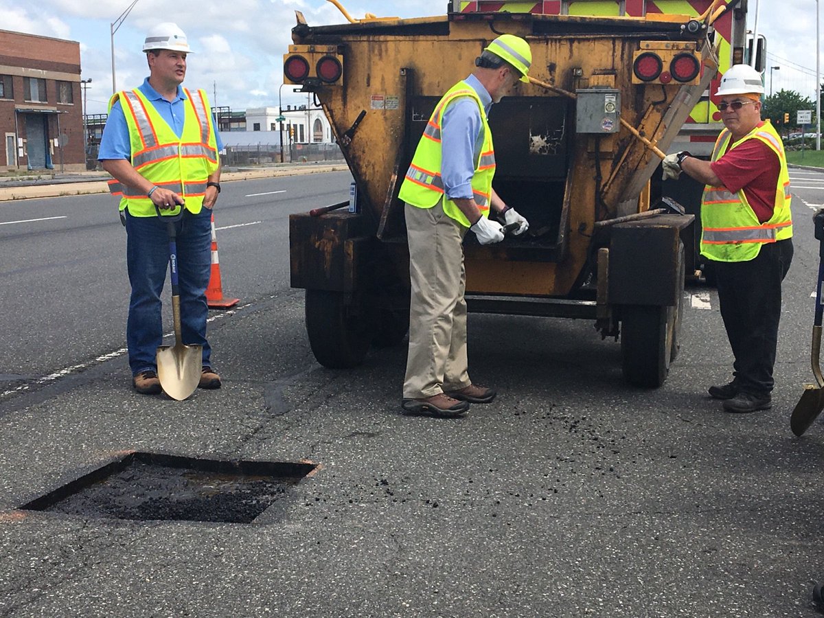 Photo of Governor Wolf fixing pothole