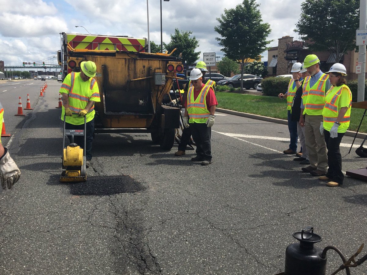 Photo of Governor Wolf fixing pothole