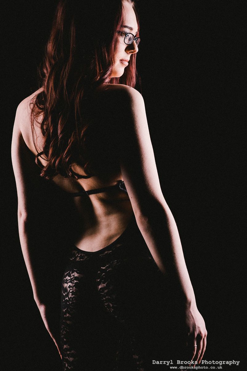 dbrooksphoto's tweet image. Looking through my feed I find this #splitlighting pattern occurring again and again.  I love it though!  
This one from a calendar shoot with @amyellen36 is a fine example #calendarshoot #catsuit #girlsinglasses #curves #contours #silhouette