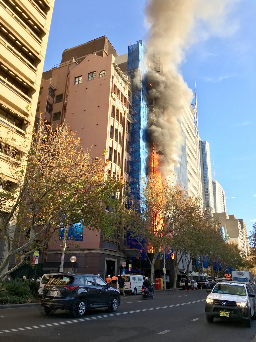 FRNSW's tweet image. SYDNEY | The fire in Macquarie St involved external scaffolding and NOT cladding. Cladding on the front of the building was removed last week. Here’s a view of the blaze that firefighters encountered on arrival. #FRNSW has extinguished the fire &amp;amp; salvage &amp;amp; overhaul is underway.