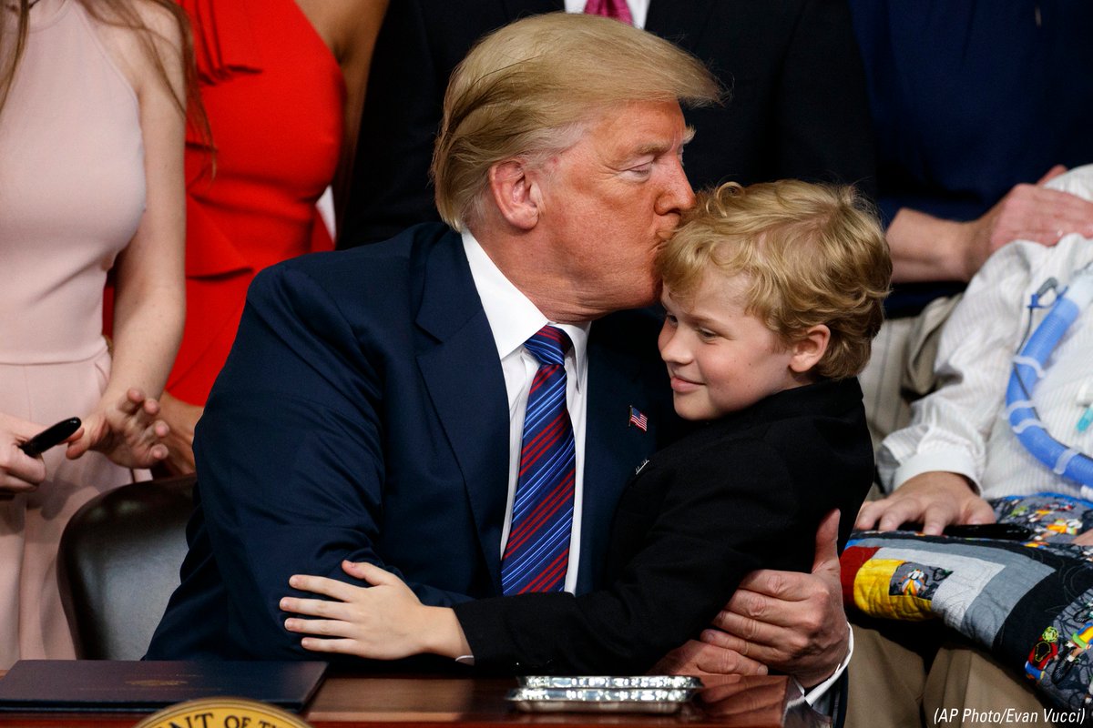 FoxBusiness's tweet image. President Donald J. #Trump kisses Jordan McLinn, a Duchenne Muscular Dystrophy patient, after signing the "Right to Try" act, earlier. fxn.ws/2kCWIDM