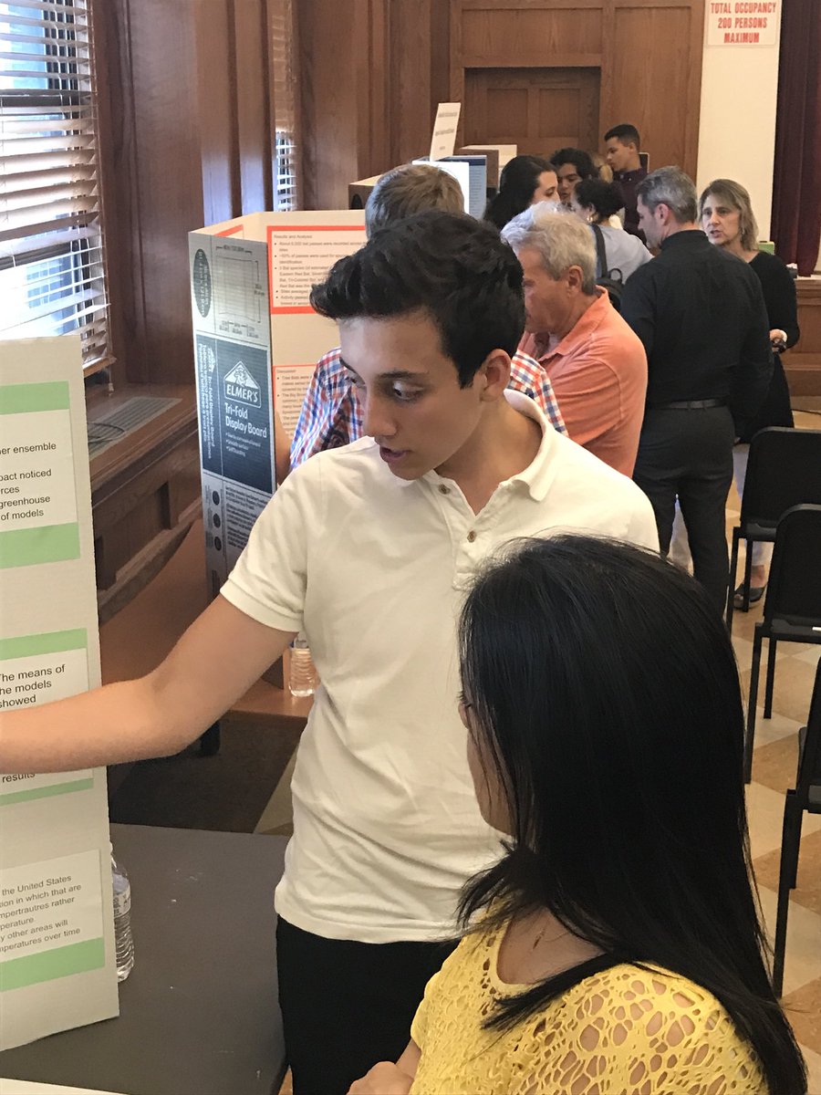 Student Science Researchers explaining their research to interested visitors and guests at this year’s Science Research Symposium at Port Chester High School. #PCpride
