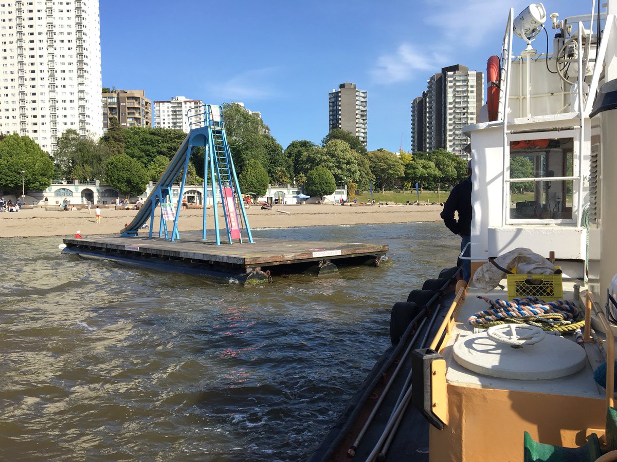 ParkBoard's tweet photo. Happening now! The βQueen Maryβ summer swim raft is getting towed to its summer home at #EnglishBay. Rafts at Kits, Jericho, and Locarno beaches will be installed tonight too! #PBsummer https://t.co/rEmkq2IWhr