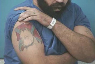 FOXNashville's tweet photo. NEW PHOTOS: TBI sent these photos of Steven Wiggins' tattoos. PLEASE SHARE to help officers find this man, accused of killing a Dickson County deputy. He's considered armed and dangerous. See him? Call 911. https://t.co/RyHNSWaojP https://t.co/vygE1Kg9go
