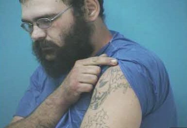 FOXNashville's tweet photo. NEW PHOTOS: TBI sent these photos of Steven Wiggins' tattoos. PLEASE SHARE to help officers find this man, accused of killing a Dickson County deputy. He's considered armed and dangerous. See him? Call 911. https://t.co/RyHNSWaojP https://t.co/vygE1Kg9go