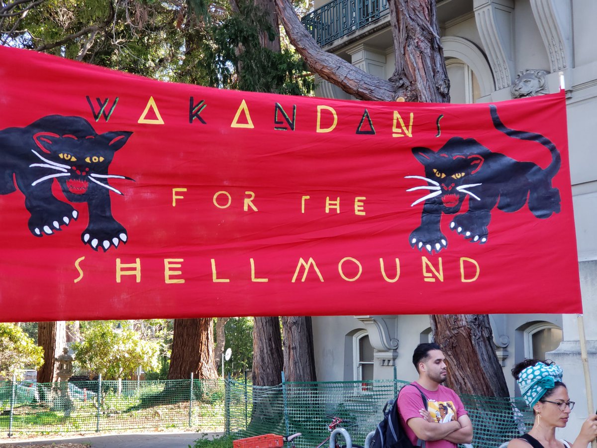 PennieOpal's tweet photo. Wakandans for the Shellmound - before the Berkeley City Council meeting to save the Berkeley Shellmound, an Ohlone sacred site
#westandtogether #savetheshellmound #protectberkeleyshellmound
#WakandaForever https://t.co/NHFCPBGO8u