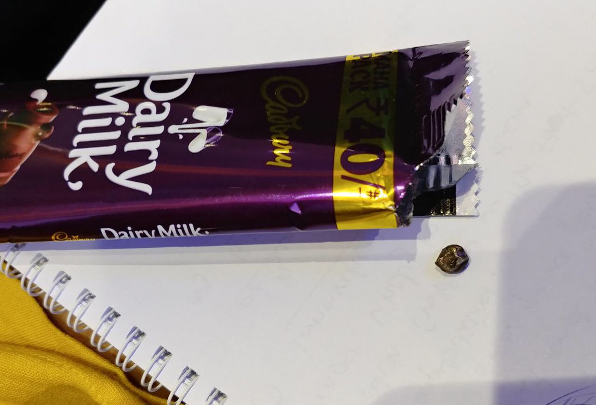 Gaaspoos's tweet image. A piece of metal found in a Cadbury dairy milk! Where exactly are we going with the product quality?!@MDLZ  @DairyMilkIn