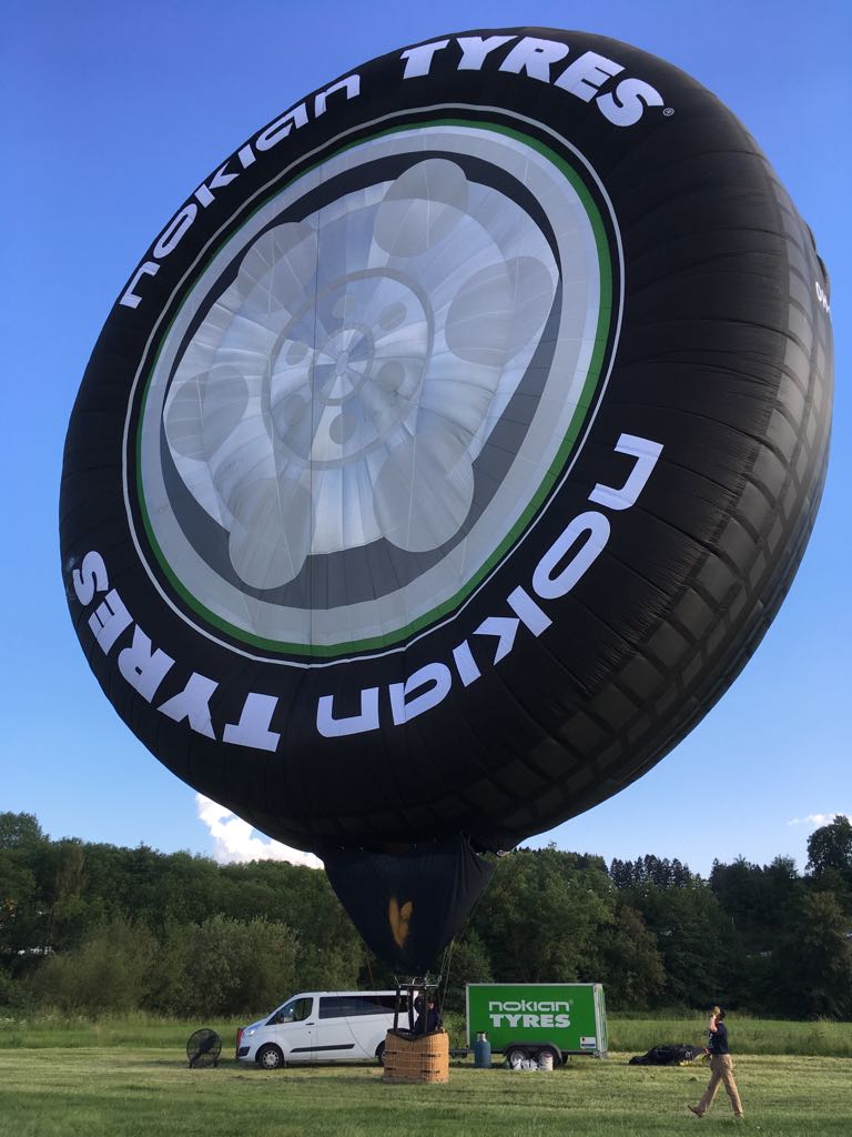 #NokianTyres advertising the old fashion way - on air at #TheTireCologne. With a diameter of 24 m or the height of an 8-storey building, our "tire" is probably the #biggest in the world. For you #tire #pro's out there: the specs are 7785/55R608. Big.