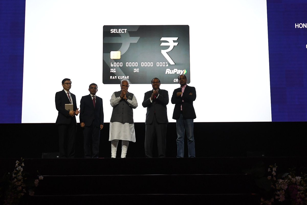PIB_India's tweet photo. PM @narendarmodi at the launch of RuPay, BHIM App and UPI by SBI, Singapore at Marina Bay Sands Convention Centre, Singapore. https://t.co/8f7h5LPCFs