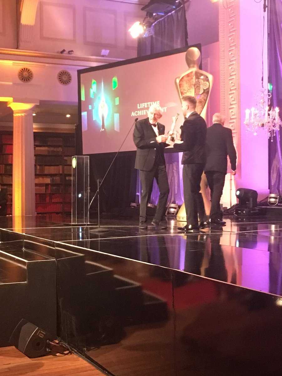 IFTA's tweet photo. Shay Healy receives the Lifetime Achievement Award for his legendary career to standing ovations! #IFTAGala18 https://t.co/kxSHdu03N8