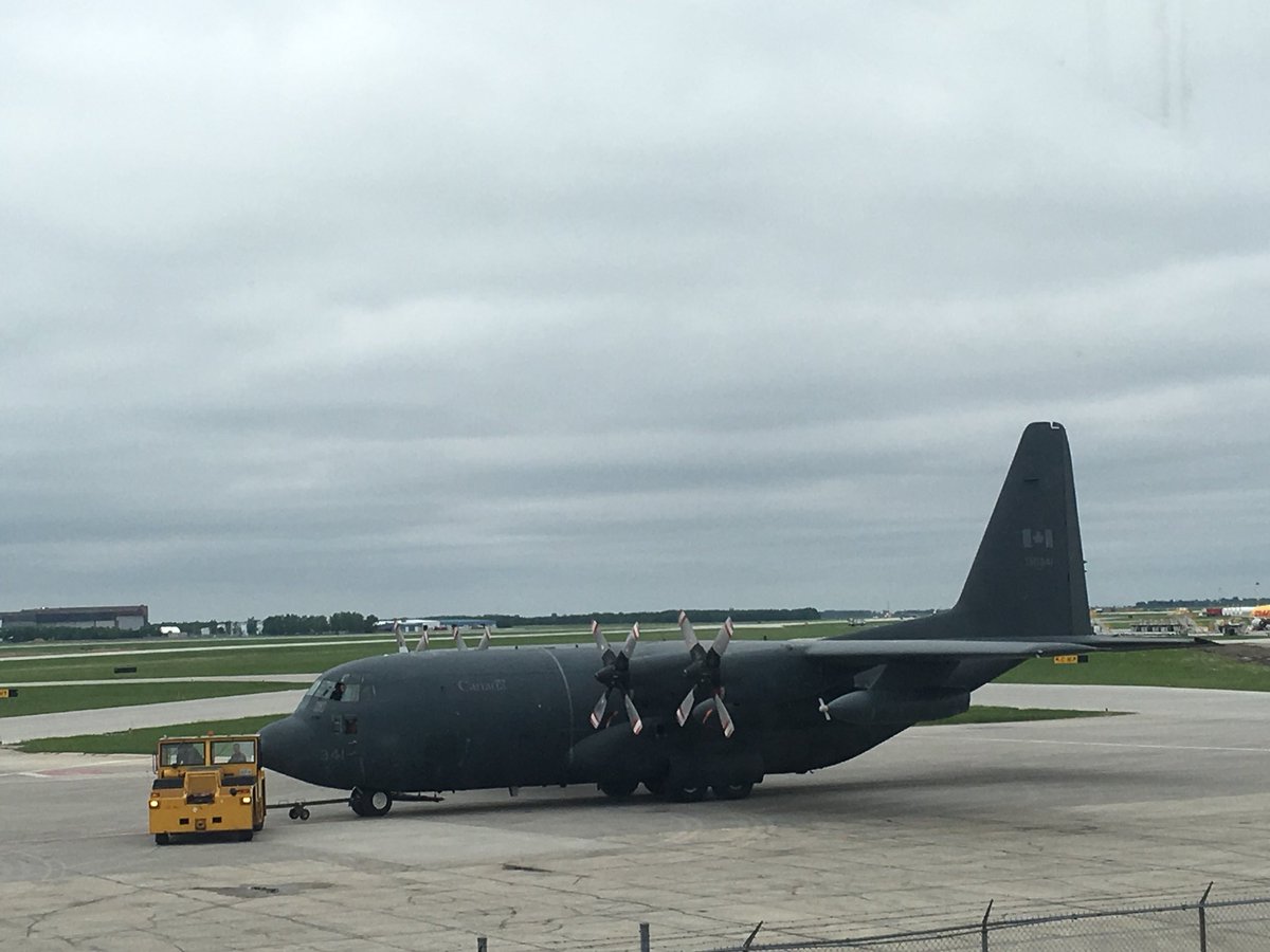 RoderLorne's tweet image. The view outside of my office window today.  The school bus, full of kids is leaving, but the giant CF-130 Hercules transport is arriving for the 435 Squadron formal “mess dinner” tonight.
Wow. @HistoryoFlight @winnipegschools @RCAF_ARC @mbaerospace