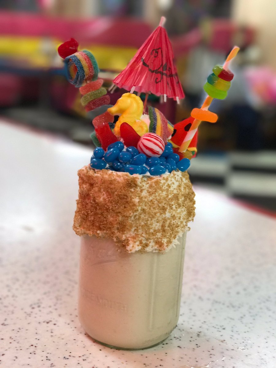 June's special shakes of the month is here!!! It's called "Life's a beach" and it is a Piña Colada milk shake with various candies loaded on top. Summer is here! 😋🙌🏻☀️⛱🍦🍭