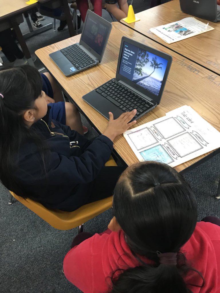 Second graders presenting their biome google slides to 1st and 3rd graders