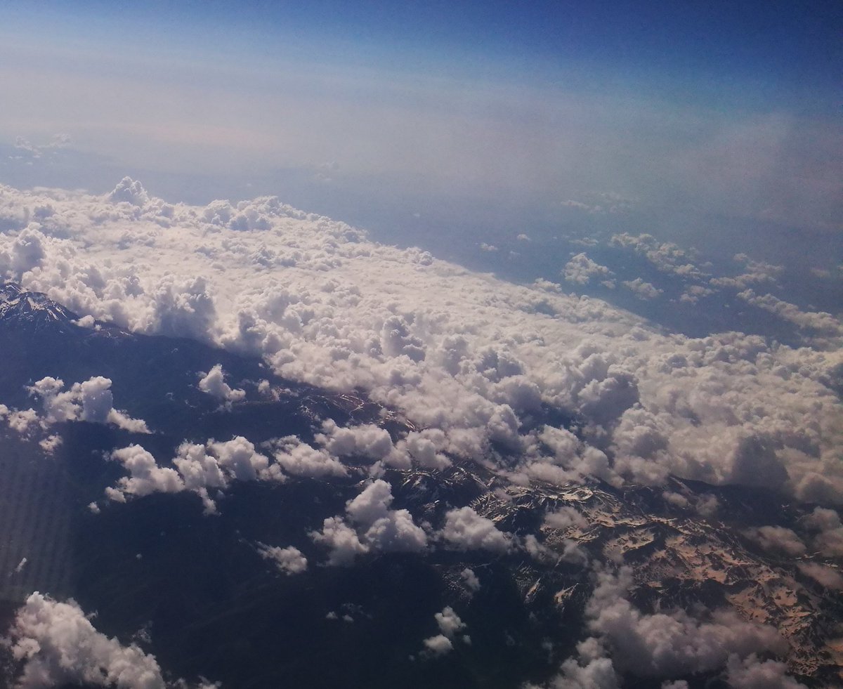Aerial view of mountains surrounded by clouds