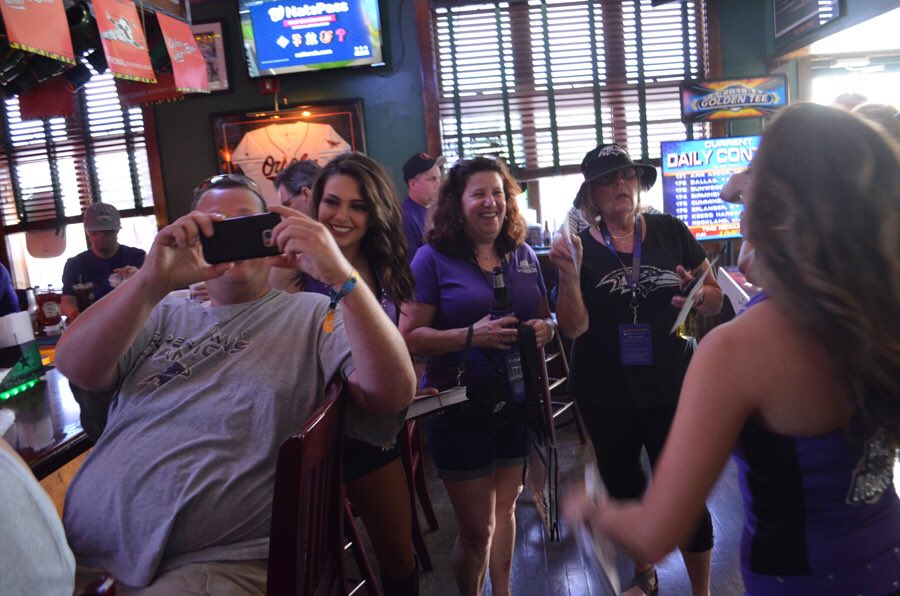 98Rock's tweet photo. .@Amelia98 helping to turn the Greene Turtle purple. #beachbash98 #RavensFlock #ravens https://t.co/EYNtWGXMx9