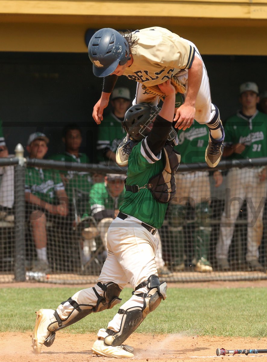 Roxbury’s Michael Roumes is tagged out/shoulder pressed as he attempts to leap over Pascack Valley’s Austin Piorkowski during the NJSIAA North 1, Group 3 final.