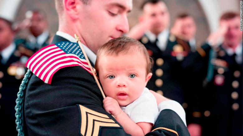 CNN's tweet photo. A soldier died before meeting his baby, so his Army family welcomed her with open arms https://t.co/betkumAR53 https://t.co/zpFvF9BrQN