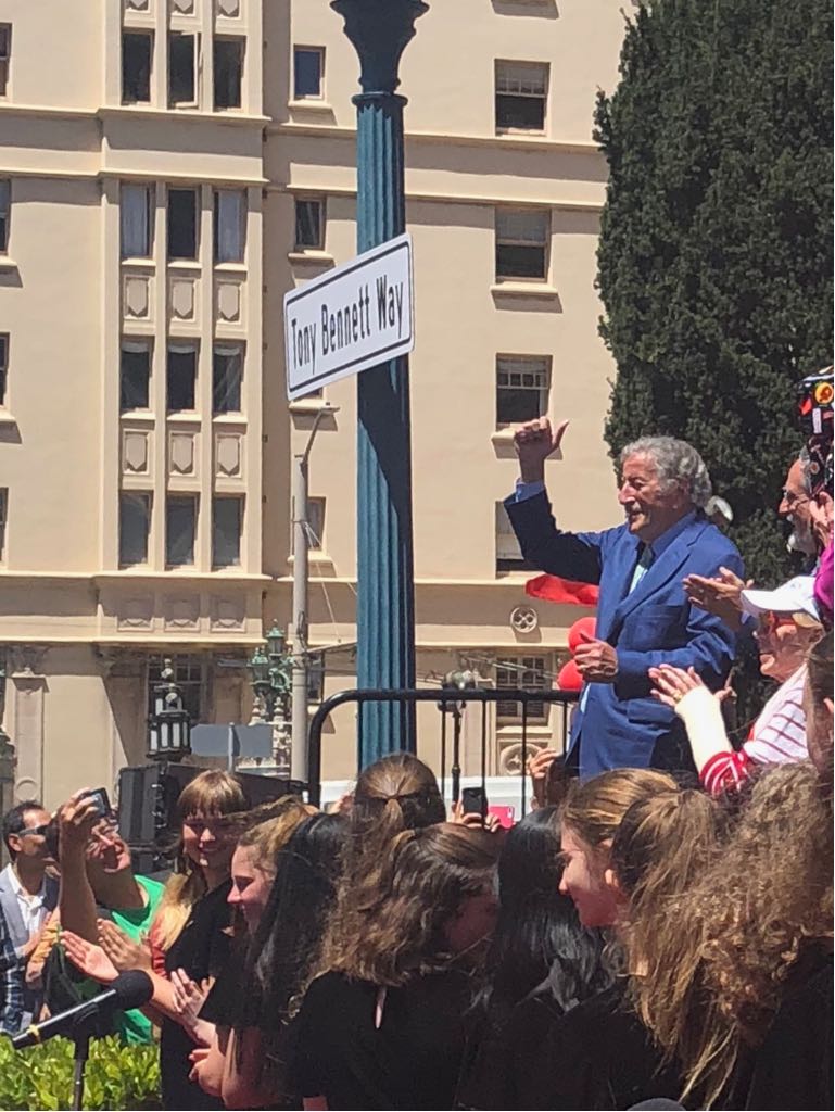 ItalyinSanFran's tweet photo. The legendary @itstonybennett unveiled his honorary street sign #TonyBennettWay in #SanFrancisco today. The ceremony was held in front of the historic @FairmontSF which was where the iconic artist first performed his classic song, "I Left My Heart in SanFrancisco" in 1961. https://t.co/67N3P1Zzmt