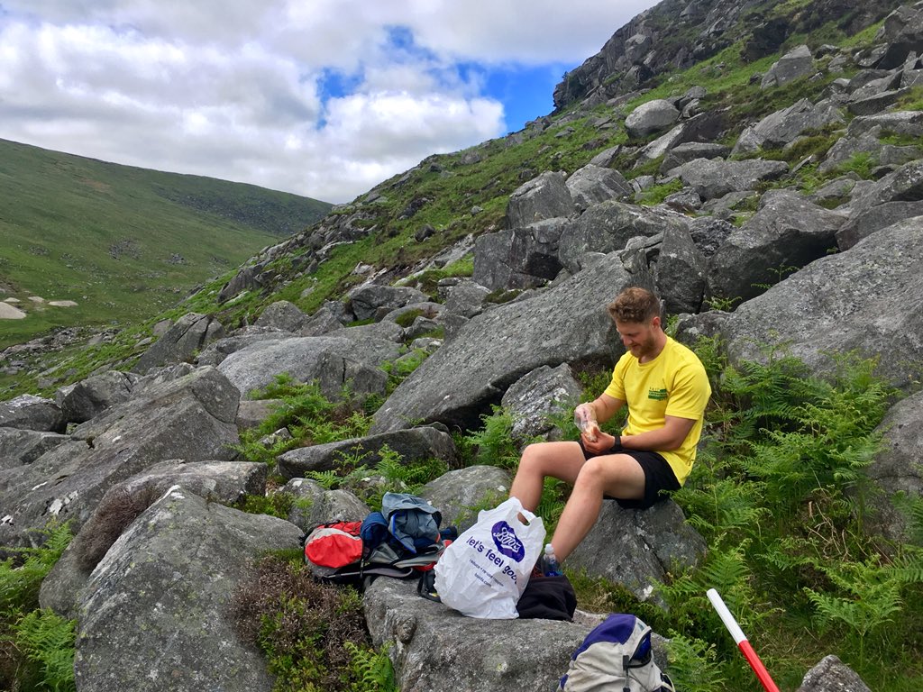 GlacialErosion's tweet photo. I think the heat got to @NoIcyNoLikey today... thinks he’s out hunting for Irish mammoths. More rocks, more slope failures and the 260th boulder sample in #glendalough #NeolithicMan #HunterGatherer #HeatStroke https://t.co/nXwt95AJpf