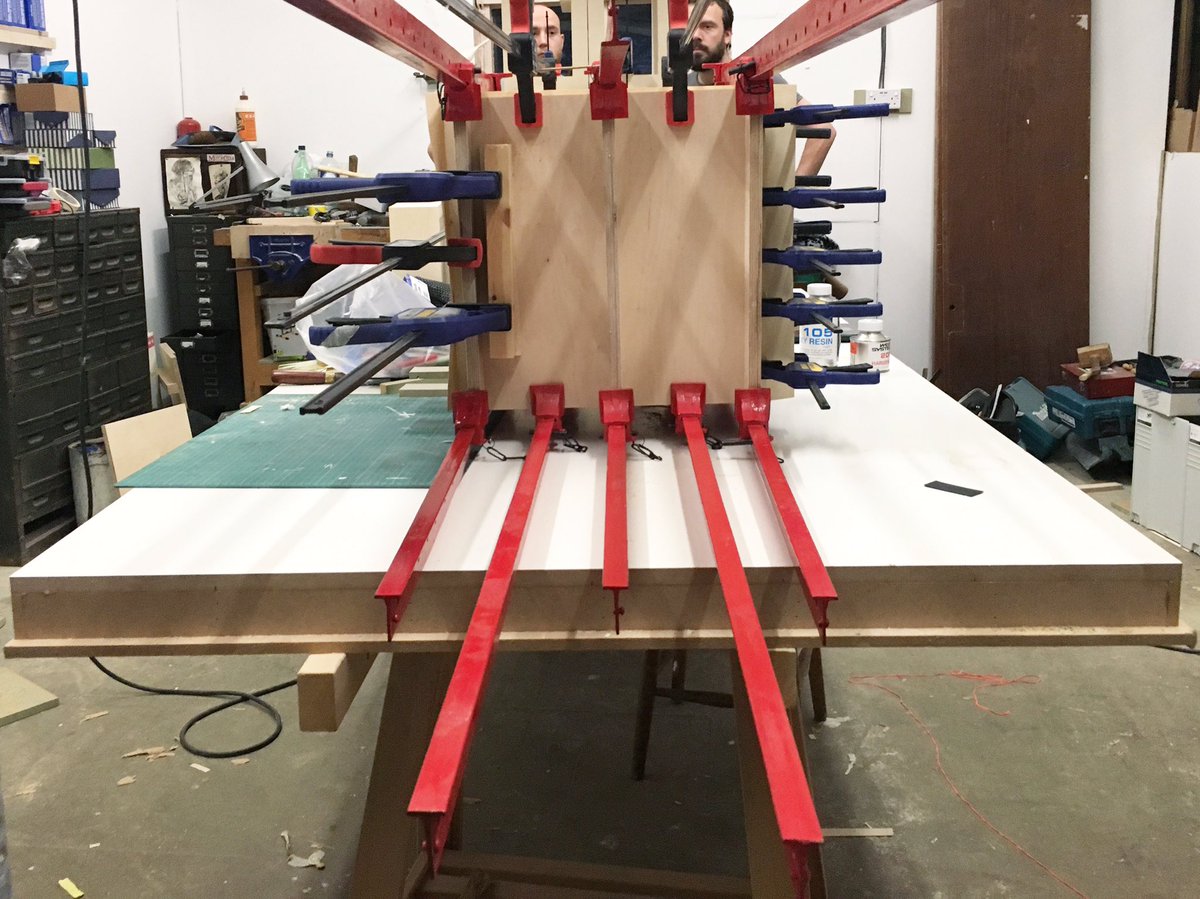 designandmaking's tweet photo. Take many clamps, lots of time, several late nights, a few helping hands, a CNC, a giant saw, a massive glue up table, some huge sheets of veneer and a serious amount of glue... what do you have? We still can't actually show you so here is some of the process in the mean time. https://t.co/Av7Ro2RNNx