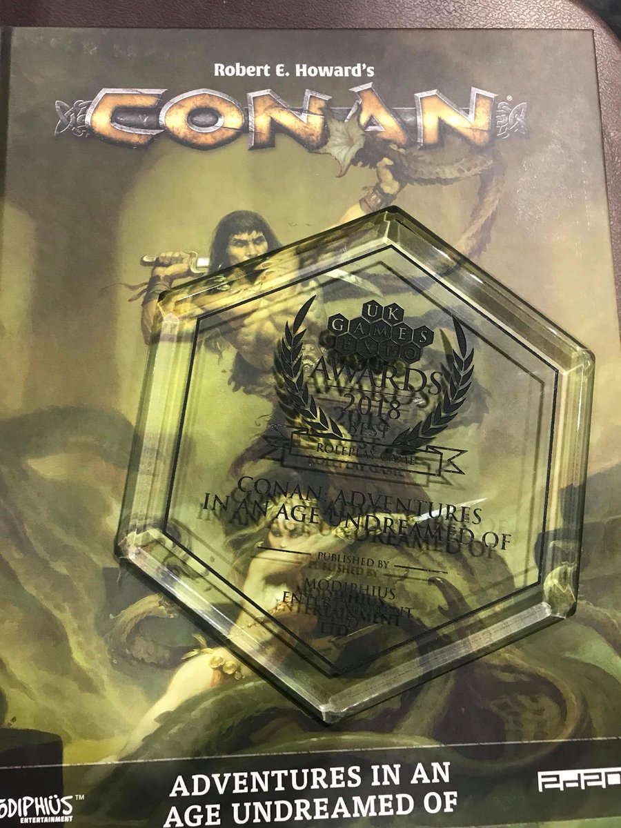 RPGamesbe's tweet photo. CONAN by @Modiphius won Game of the Year 2017 at the UK Games Expo! Congrats to the whole Modiphius and Conan team! #RPG https://t.co/zMmv3w6MVz