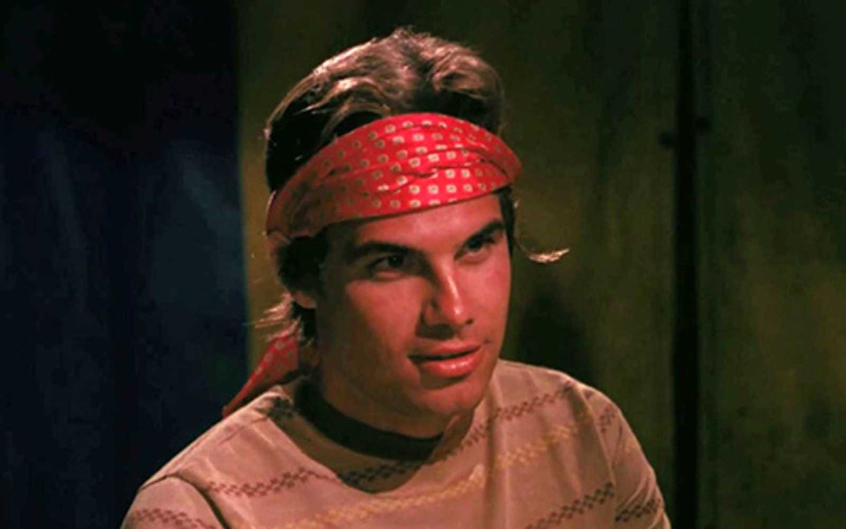 Craig Denny as Alexander in The Astrologer - he wears a bandana.