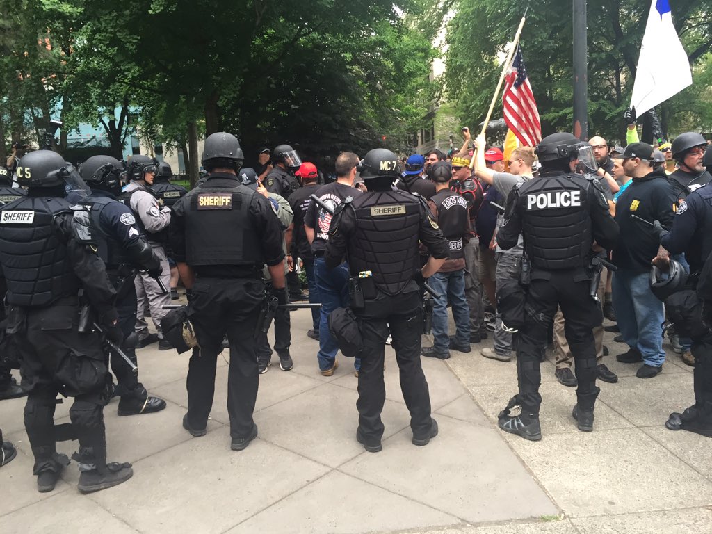 shane_burley1's tweet photo. Police surround proud boys to protect them. https://t.co/fVS1DSHja9