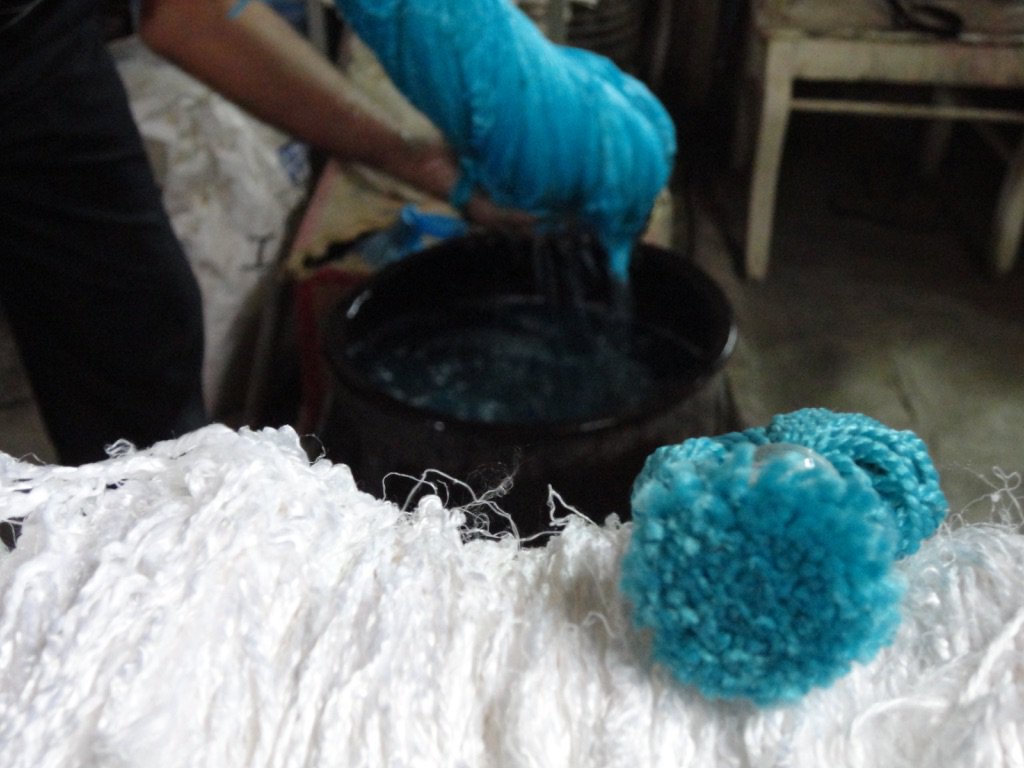 HeidarianR's tweet photo. The yarn is washed with detergent &amp; repeated with water only.The dye from the poms picked out are made from a precise combination to create the exact colours.Yarn is submerged into the dye &amp; heated to a near boiling point for a certain amount of time depending on the colour.#iran https://t.co/F7sc9XttN7