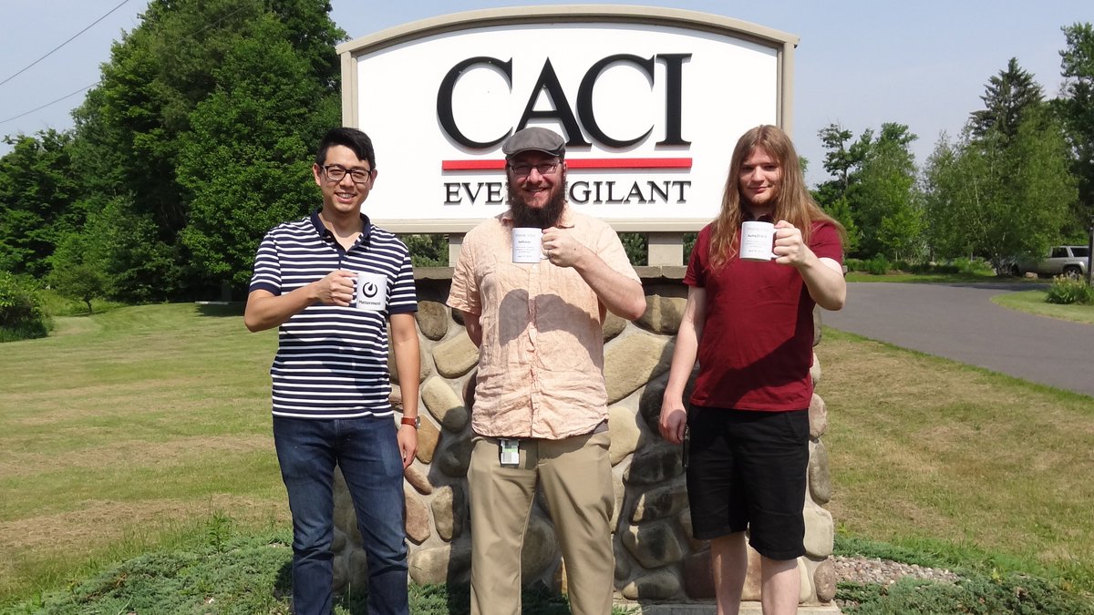 kethinov's tweet photo. The anniversary of @Mattermost is coming up soon. To celebrate they're encouraging contributors to post #mattermug pics. Here's a pic of me with two colleagues posing with our #mattermugs! https://t.co/bw0GZKWOAG