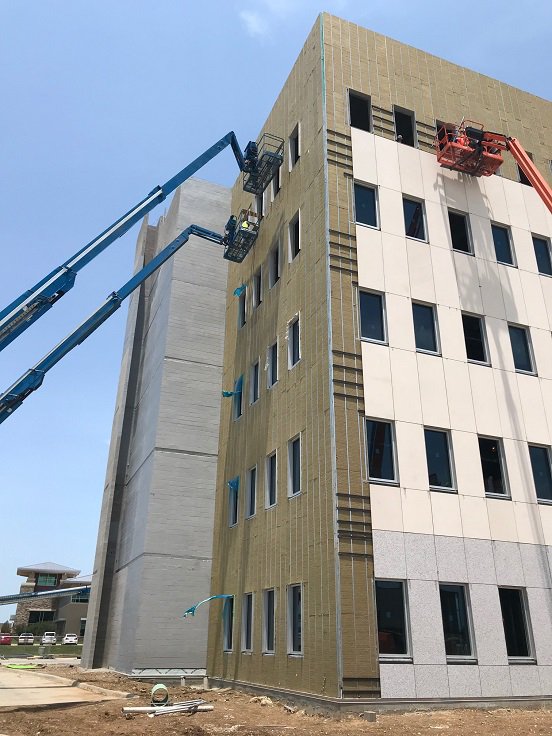 StonePanelsIntl's tweet photo. How fast can StoneLite® panels be installed?  SPI is installing our StoneLite® panels on the multi-story exterior façade of First State Bank HQs. We are currently installing at a rate of 2,900 sf per week and have the potential to be finished one month ahead of schedule. https://t.co/9MX0LD9qeD