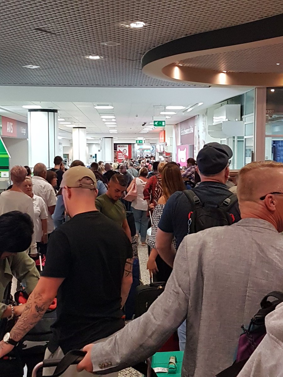 GlennNotley's tweet photo. The queue at the tui desk after a 7 hour delay and cancelled flight #whatadisgrace. Please retweet.  No food no drink no plane and NO TUI STAFF. https://t.co/no6aZXlVZQ