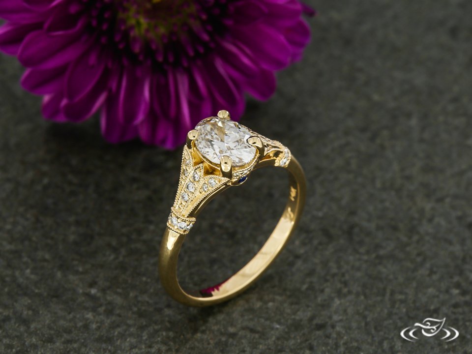 Jewelryworks's tweet photo. #Golden #Diamond filled flowers and a #PeekaBoo side sapphire add sparkle to this #OvalDiamond #EngagementRing. #GreenLakeJewelry #ArtistsAtWork https://t.co/sw5p6pYouz