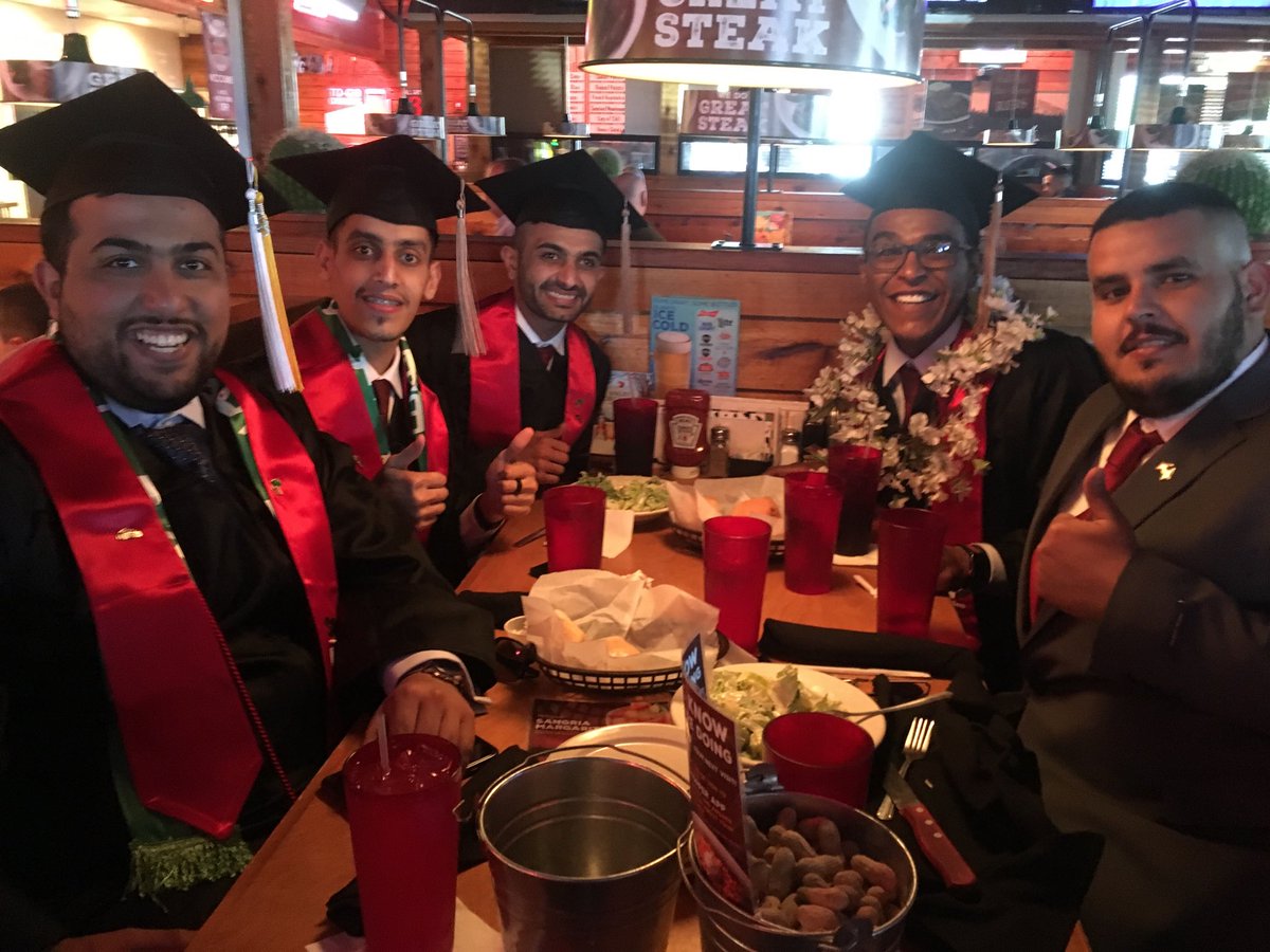 LindaKSchott's tweet photo. Found these SOU grads having lunch and still looking sharp in their caps and gowns! Congratulations and safe travels back to Saudi Arabia. @SOUAshland #RaiderUp #souclassof2018 https://t.co/DwrHzuHx2r