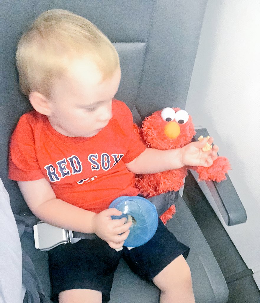 EricaDeLong's tweet photo. When You have @elmo feeding you #SnacksOnAPlane https://t.co/6mXm1RpS3g