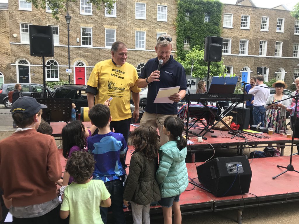 NewsfromBedlam's tweet photo. Rev. Canon Angus of @NorthLambParish sporting our #Chartist #tshirt at the #Kennington #VillageFete in #CleaverSquare ; Ma Butler in #RebelsoftheRiveSud #truckercap .The Chartists brought about the right to #vote for the common man. #London #community #cradleofdemocracy #SE11 https://t.co/qWS8ws0Ilu
