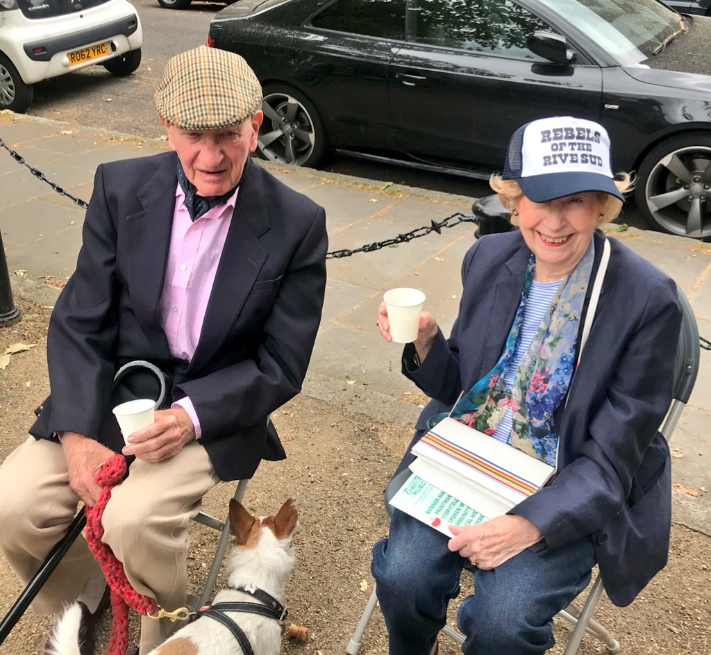 NewsfromBedlam's tweet photo. Rev. Canon Angus of @NorthLambParish sporting our #Chartist #tshirt at the #Kennington #VillageFete in #CleaverSquare ; Ma Butler in #RebelsoftheRiveSud #truckercap .The Chartists brought about the right to #vote for the common man. #London #community #cradleofdemocracy #SE11 https://t.co/qWS8ws0Ilu