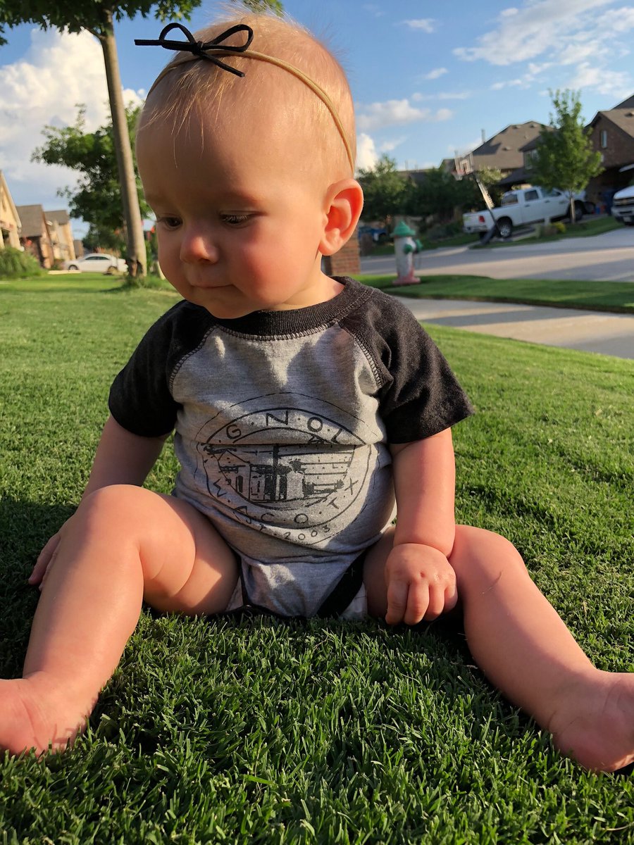 Ryan_Ishmael's tweet photo. First time rolling in the grass, in her @magnolia onesie. @chipgaines @joannagaines let us know if y’all need a beautiful onesie model baby for the next line of onesies. 
#burblife #biasedmaybe https://t.co/Oajof3JEMv