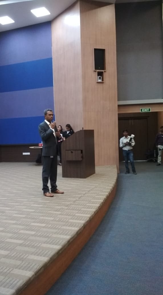CapgeminiIndia's tweet photo. Krishnamurthy Voora VK, Head - Global  ADM &amp; CSD, Capgemini Financial Services delivers the opening address as he welcomes clients, colleagues, students and partners at #TechFiesta2018 Pune chapter https://t.co/Cf3ZzGqNdd