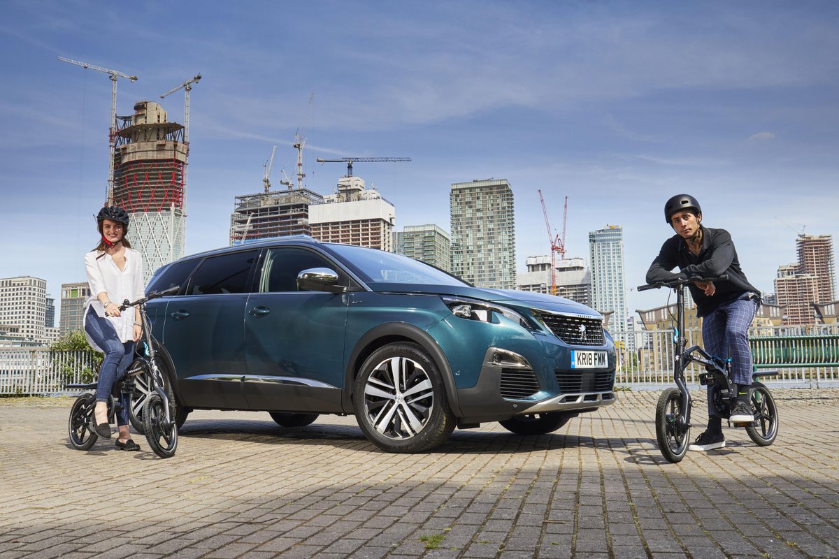 ClassicanaUK's tweet image. Peugeot's electric bicycle, the eF01 (range 18-25 miles) is now on sale in the UK. No price given as yet. According the #Peugeot it integrates into the boot space of the all-new 5008 SUV, again they don't say how. We think they mean it fits in the back! #bicycles #sustainability