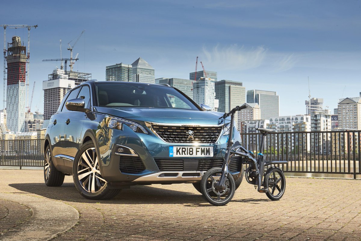 ClassicanaUK's tweet image. Peugeot's electric bicycle, the eF01 (range 18-25 miles) is now on sale in the UK. No price given as yet. According the #Peugeot it integrates into the boot space of the all-new 5008 SUV, again they don't say how. We think they mean it fits in the back! #bicycles #sustainability