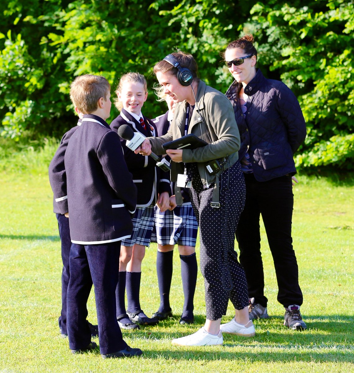 SAnselmsPrep's tweet photo. Thanks to @BBCRadioDerby for braving the windy start to join us this morning for our High Altitude Balloon launch. The children loved beign interviewed and it all added to the excitement! Our balloon with #Bakewell Pudding attached is en route for Lincolnshire @RealBakewellPud https://t.co/gduFvDT1Aa