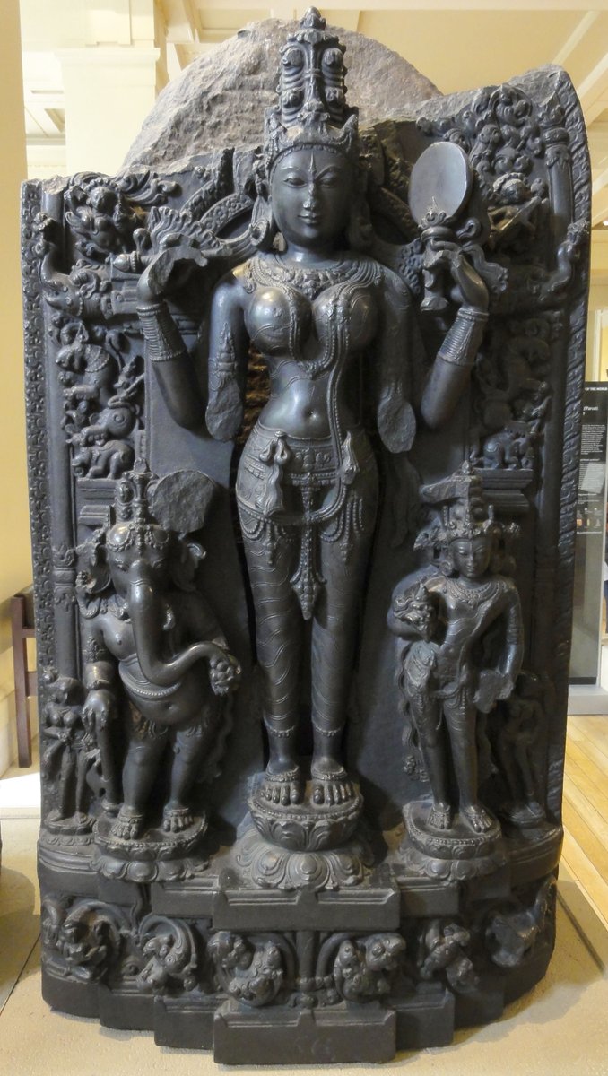 A partially damaged (islamic iconoclasm) 900 year old murthi of goddess Lalitha Parameswari (Parvathi) flanked on either side by her sons Ganesha & Skanda, belonging to the Pala era. Observe the mirror in left hand! Now illegally held at the british museum  http://www.britishmuseum.org/research/collection_online/collection_object_details.aspx?objectId=251395&partId=1&searchText=lalita&page=1