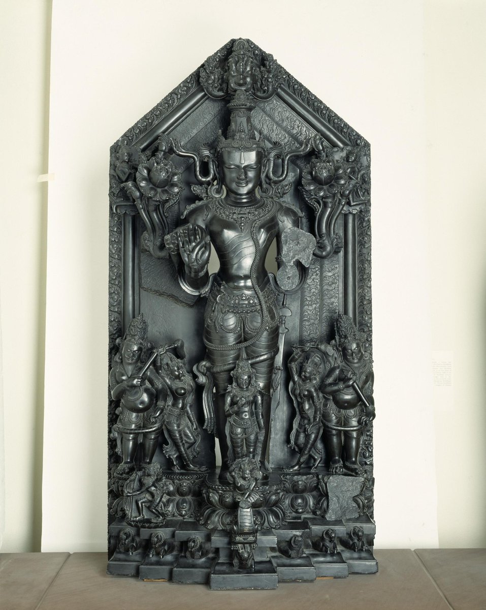 This is absolutely the most amazing sculpture of Lord Suryanarayana I've ever seen! Talk about chiseled look! Pay attention to the kirttimukha, the kamala, the sword in his left hand.Also seen are his consort Prabha & his charioteer, Aruna. Smuggled at V&A  http://collections.vam.ac.uk/item/O25158/surya-figure-group-unknown/