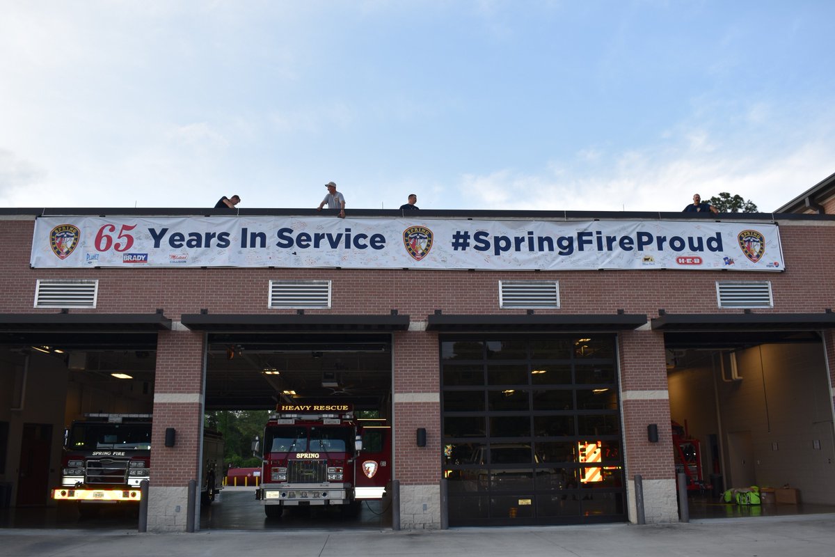 Springfdtx's tweet photo. The @Springfdtx is grateful every day for the support #SpringTX has shown us over our first #65YearsInService. Early today, our facilities crew and Station 71's crews worked together to hang a banner -- signed by many of you -- over Station 71's bays. #SpringFireProud https://t.co/HZ11w5UvHr