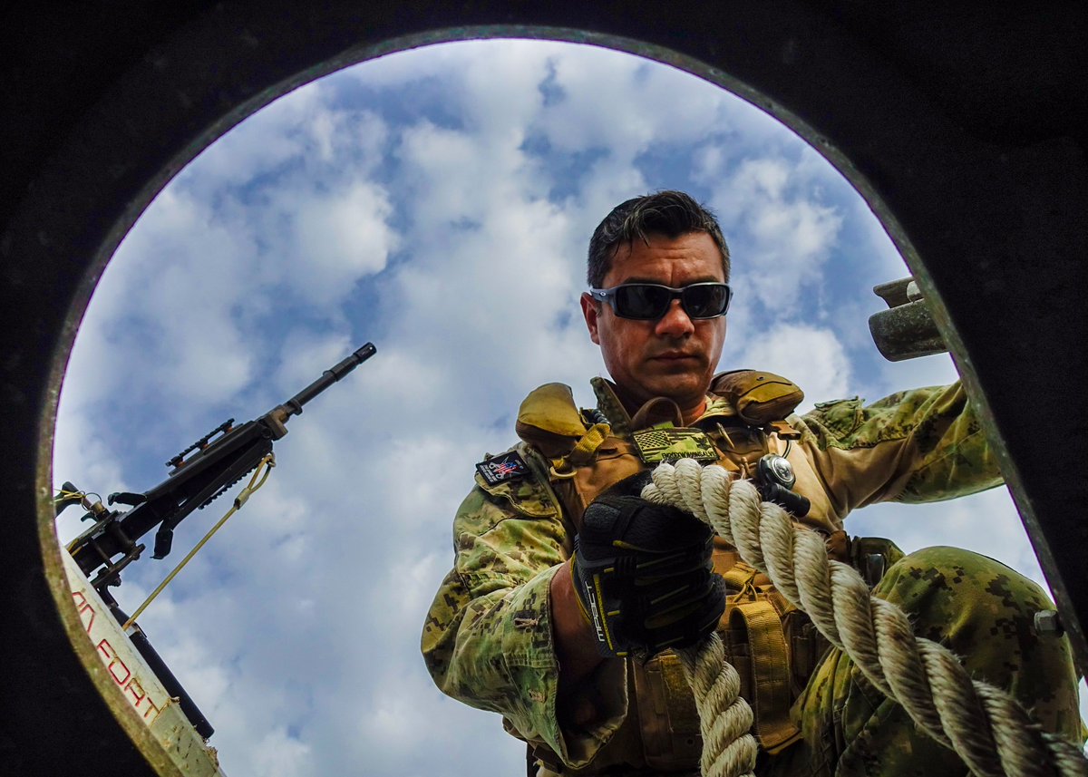 Engineman 2nd Class Carlos Monsalve, assigned to #TG686, reaches for an anchor aboard a patrol boat during a pre-underway check in the #GulfofTadjoura, #Djibouti, May 31, 2018.